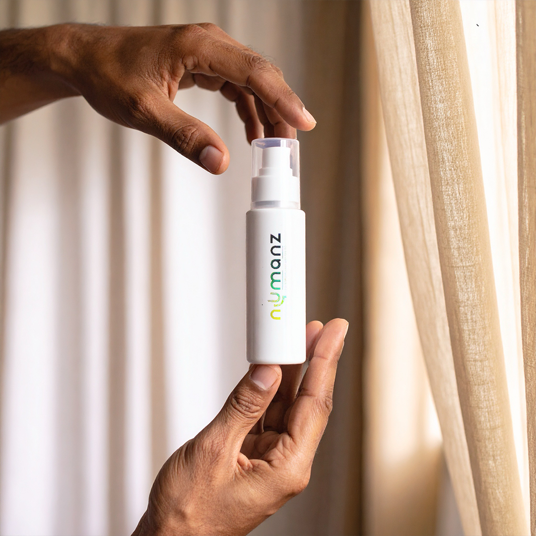 Numanz SPF 50 face moisturiser spray for men with cactus extract, providing hydration and sun protection for Indian skin.